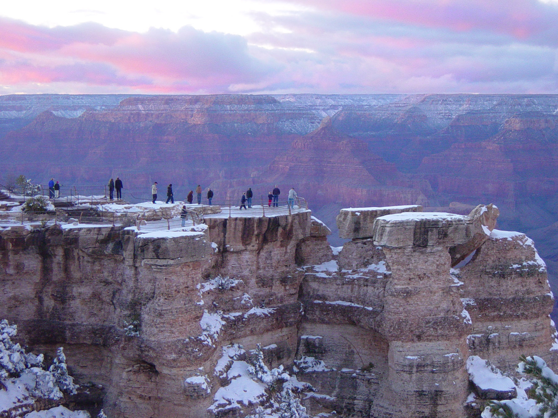 Grand Canyon_Winter Sunset at Mather Point_D2543
Visitors at sunset viewing the canyon from Mather Point on the South Rim after a dusting of winter snow. Grand canyon national park. To help plan your visit to Grand Canyon National Park visit: www.nps.gov/grca/ This is the highest resolution available. NPS photo by Michael Quinn