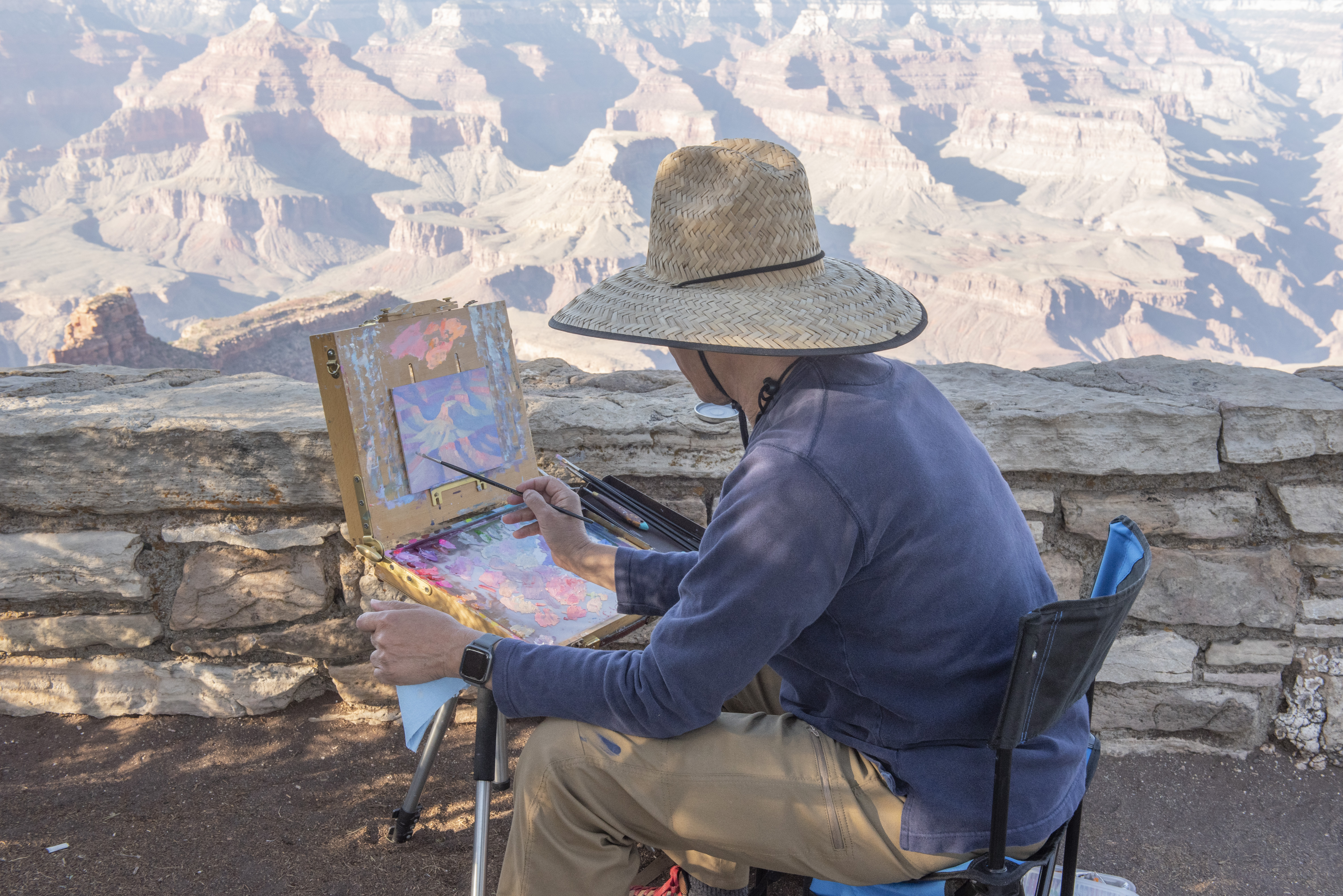 Jose painting along the rim