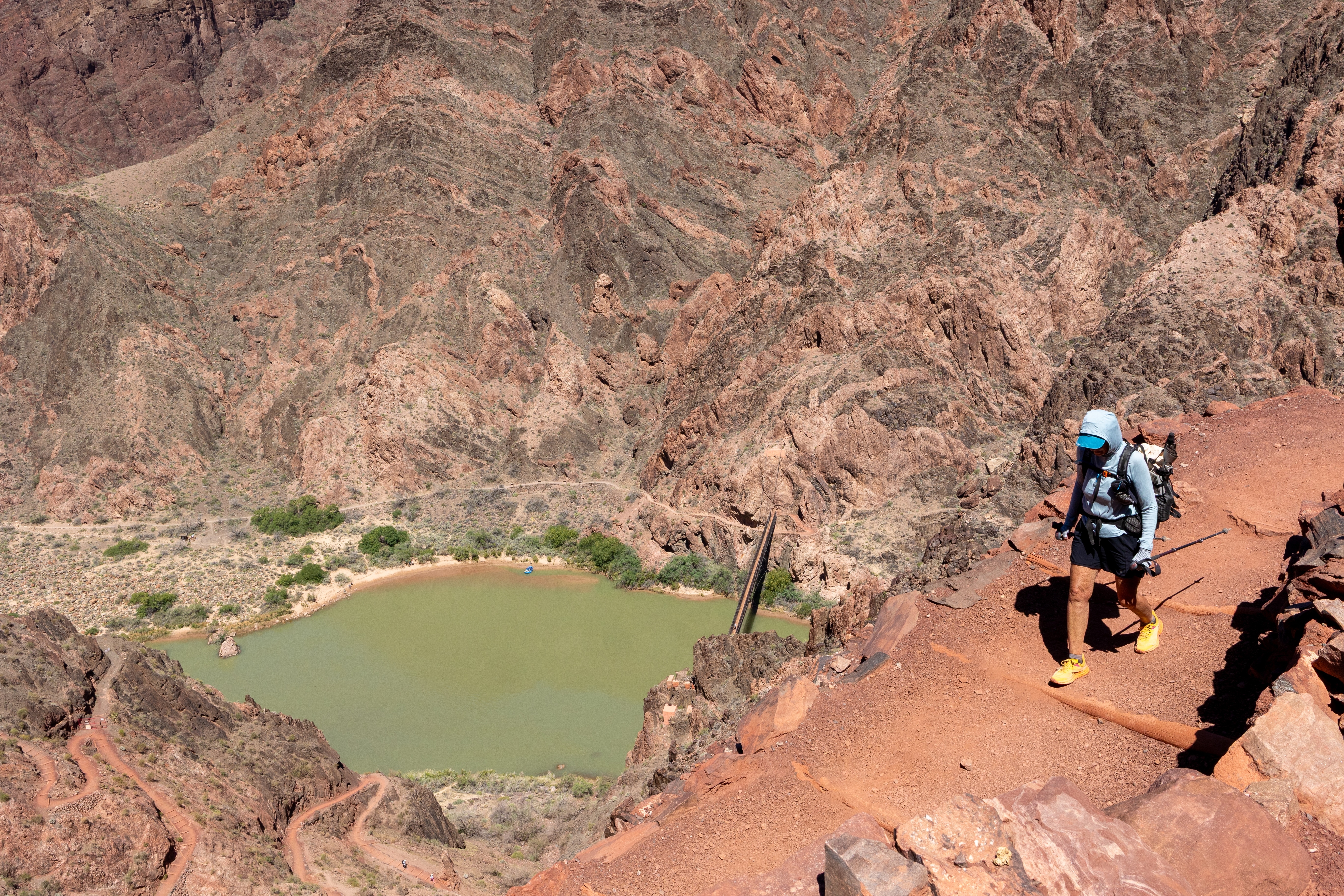A hiker descends the South Kaibab Trail with the river visible in the background. Photo: GCC L/Cisneros