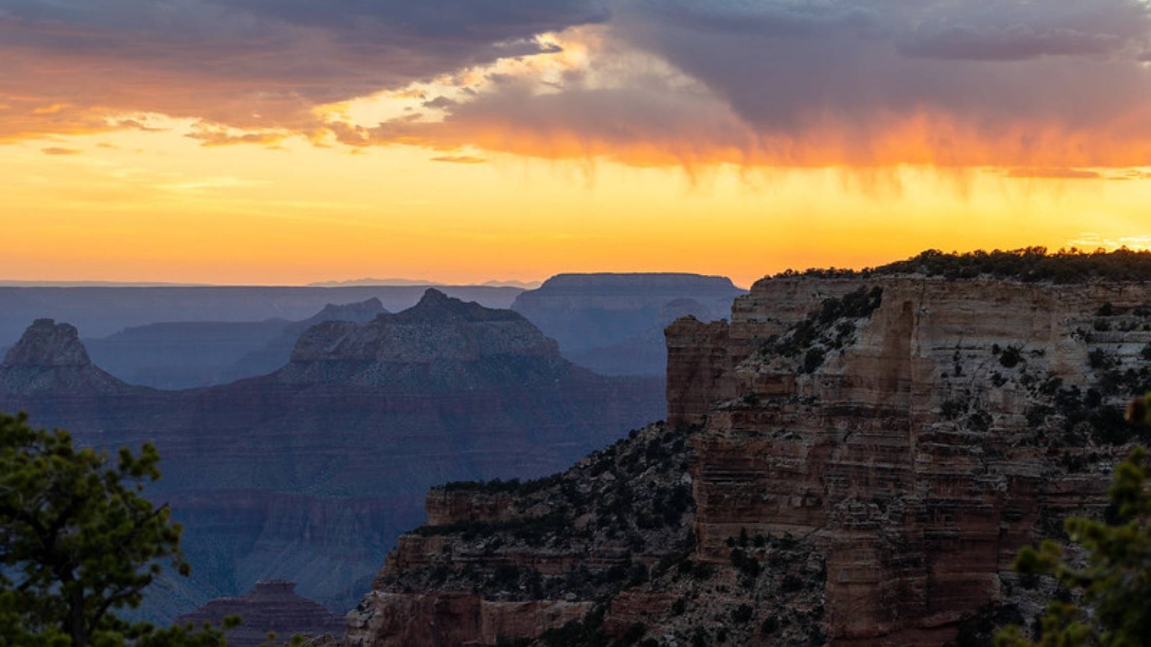 Sunset clouds and rain over the Grand Canyon