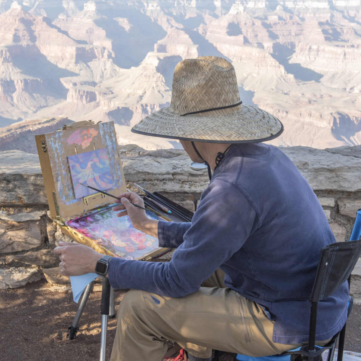 Jose painting along the rim