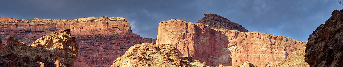 Sunset light on red canyon rocks wide panoramic view, photo by John Strother 2017