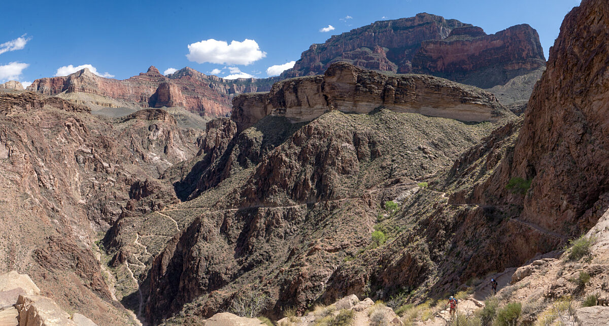Bright Angel Trail descends into Pipe Creek at the "Devil's Corkscrew" —visible on the left. With inner canyon temps reaching as high as 130 °F (54 °C) during summer, this portion of the trail should only be attempted during early morning or late evening hours.

 

Photo location is looking back towards Indian Garden from 6 mile corner