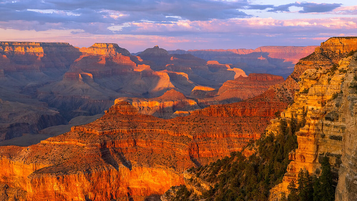 Cliffs visible at Yavapai Point glow in the fading light of day.
