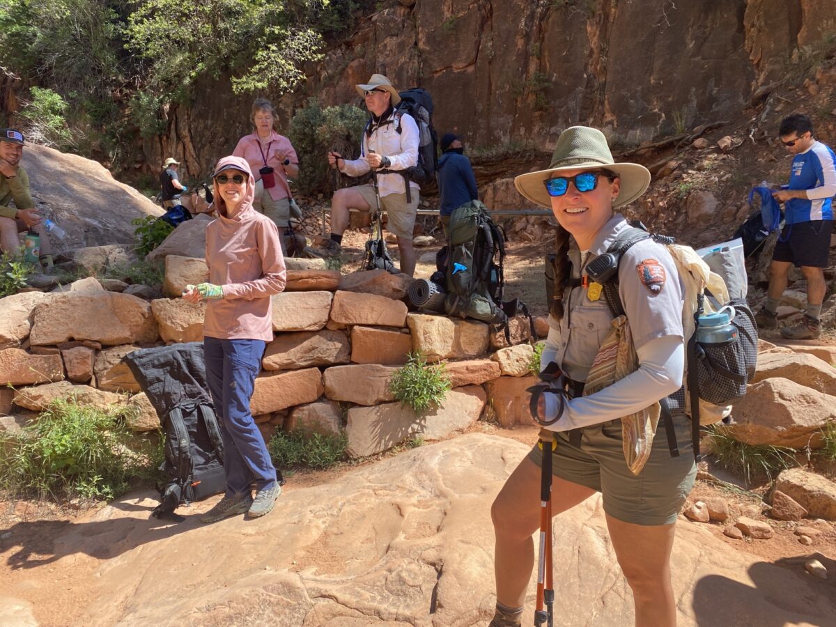 A Park Ranger and a Field Institute participant smile for the camera at Supai Tunnel on the North Rim