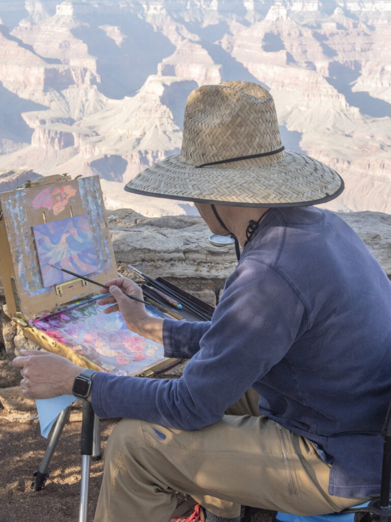 Jose painting along the rim