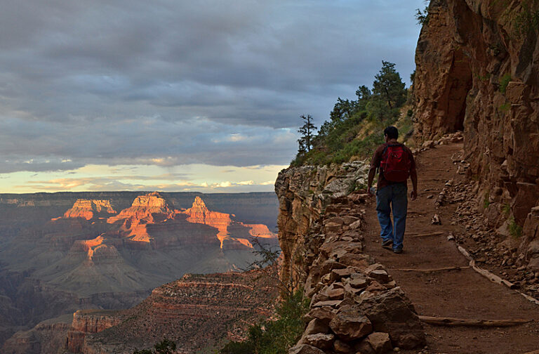 Sunset hiking Bright Angel Trail behind hiker photo 2017
