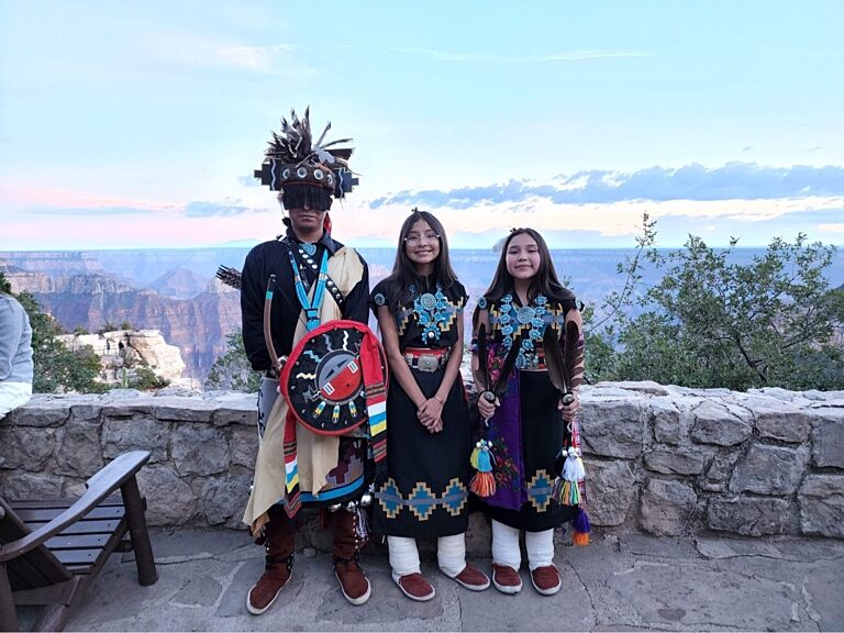 Dine Tah' Navajo Dancers
Dine Tah' Navajo Dancers stand on the Grand Canyon Lodge veranda during North Rim Heritage Days.
August 2022, NPS Photo/L. Cisneros