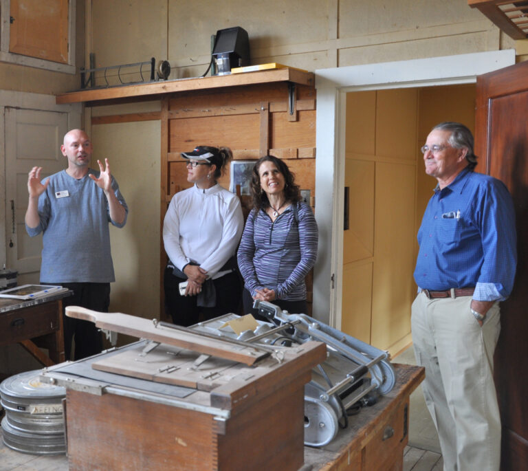 Inside kolb studio thumbnail image of visitors getting a tour of the photography room