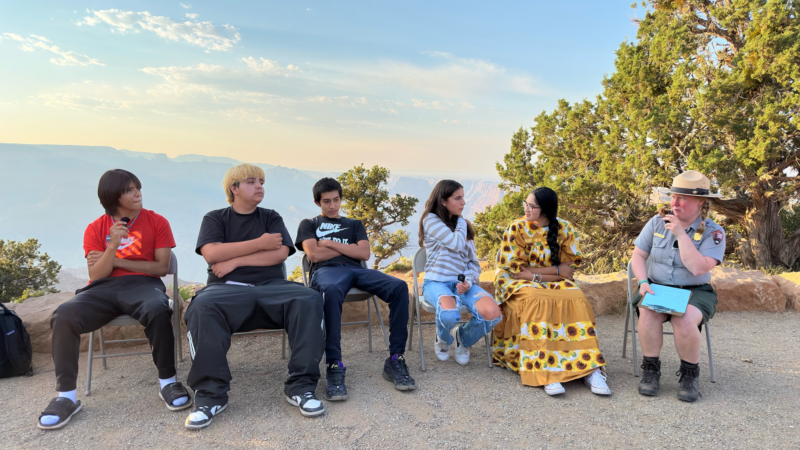 Youth being interviewed for the Grand Canyon Speaks podcast in front of Grand Canyon.