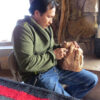 Duwayne Chee Jr seated carving wood sculpture