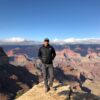 John Begay standing on edge of Grand Canyon