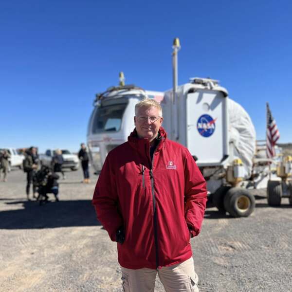 Kevin Schindler pictured in front of a NASA vehicle