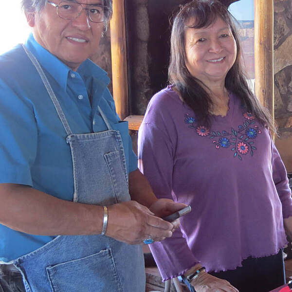 Bennard and Francie Dallasvuyoma smiling in jewelry shop