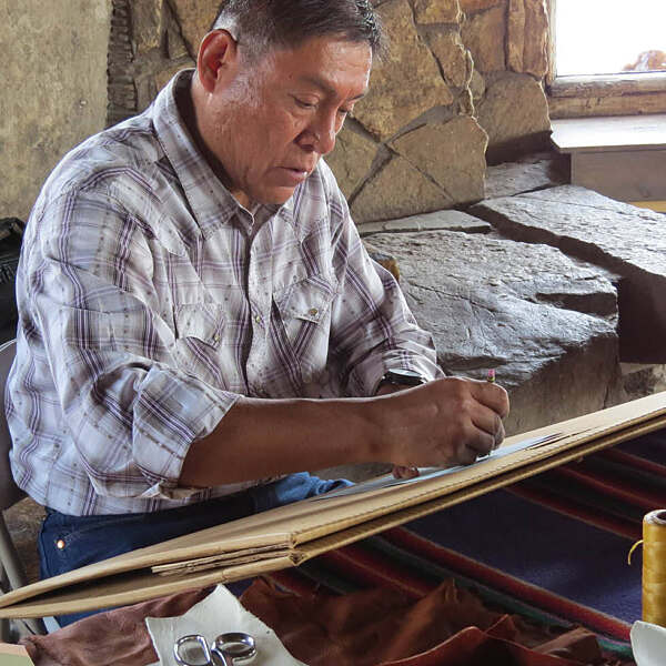 Bill Thomas Jr sitting and sketching