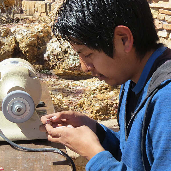 Cameron Nastacio working on carving spinning machine