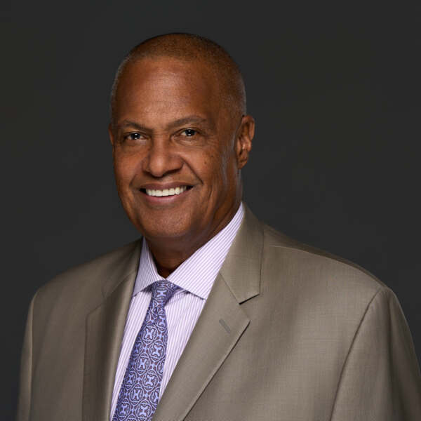 Photo of Dennis A. Johnson in business suit.