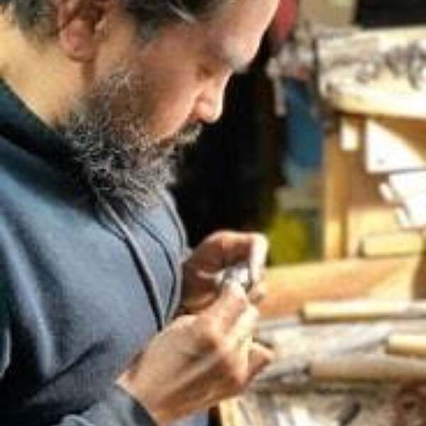 Jonah hill inspecting jewelry piece