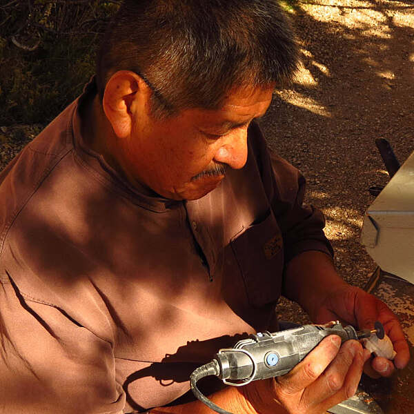 Lynn Quam carving sculpture with drill tool