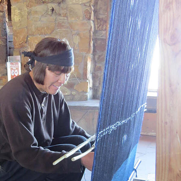Ahkima Honyumptewa working on artwork