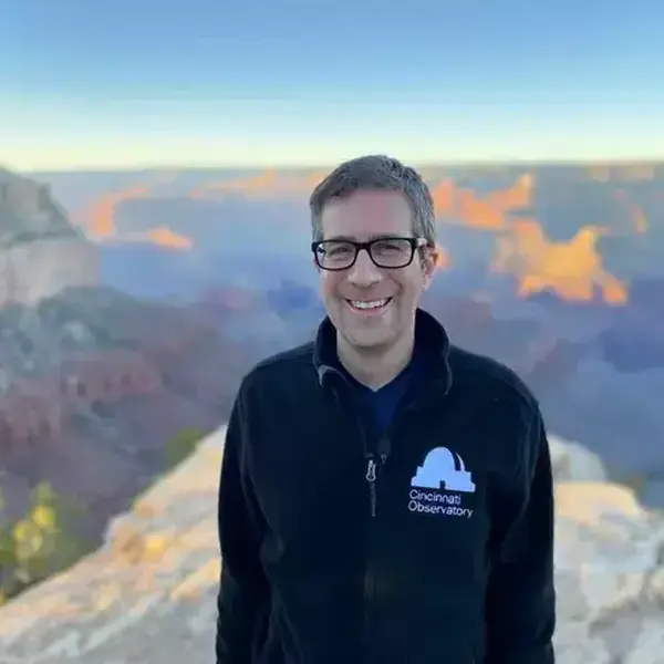 Dean smiles in front of the Grand Canyon's South Rim.