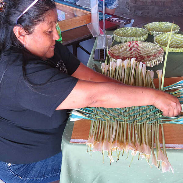 Evanette Sockyma working on artwork