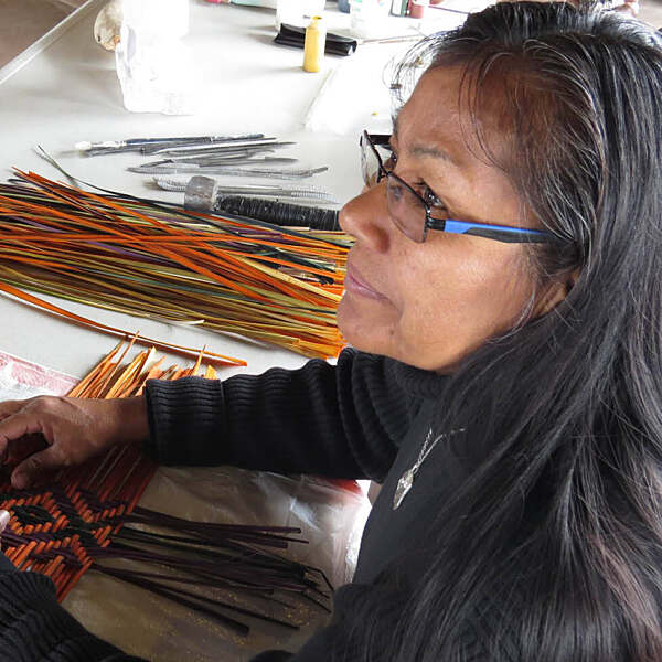 Iva Honyestewa working on artwork