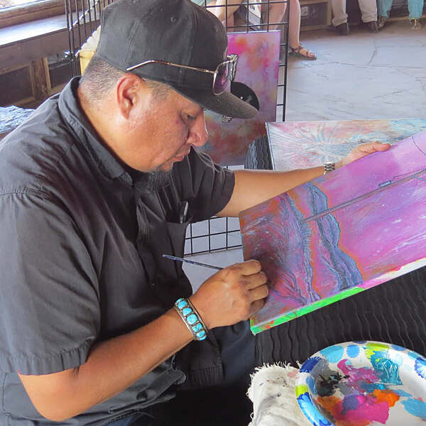 Jerrell Singer working with paintbrush in hand