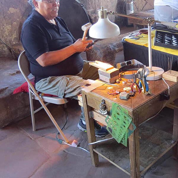 Jerry Whagado working at desk on jewelry