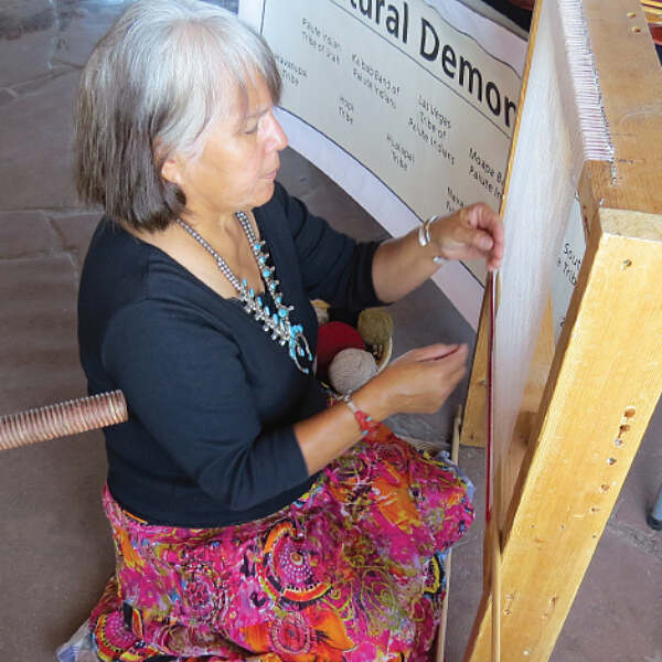 Rose Bighorse working on artwork