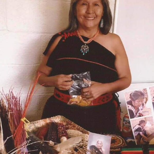Ruby Chimerica at table of artwork